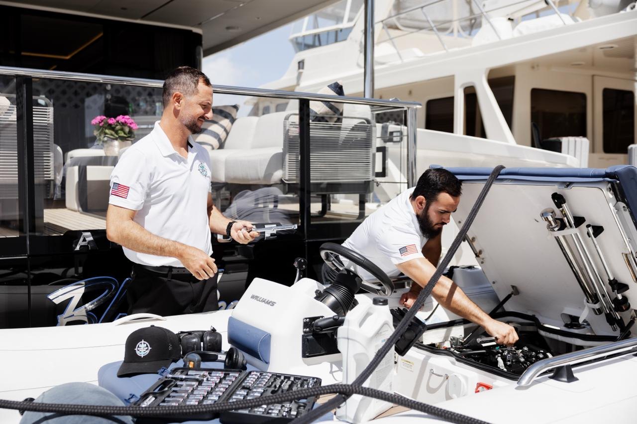 Island Tuff Marine crew servicing a tender aboard a yacht